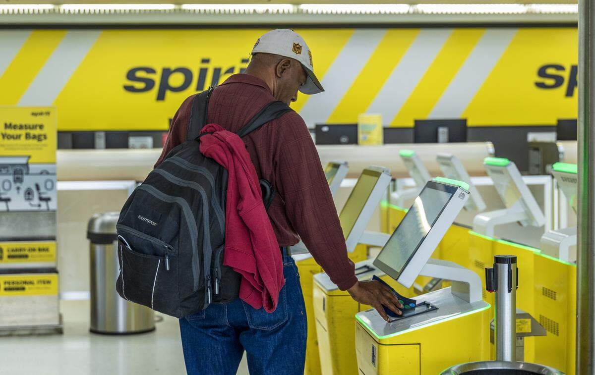 Passenger Pierre Wonet tries to check in for his flight to Tampa at Fort Lauderdale-Hollywood International Airport unaware that Spirit Airlines has shut down on Saturday, May 2, 2026.